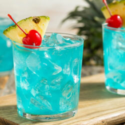 Phantom Lake garnished with pineapple and cherry