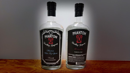 The front and back view of a bottle of Phantom White Fog